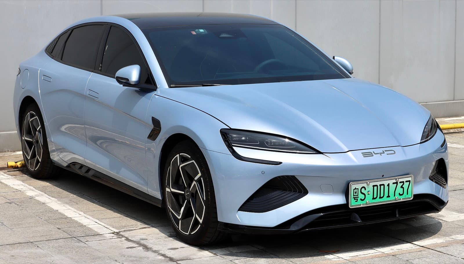A light blue BYD Seal electric sedan parked outdoors, front three-quarter view