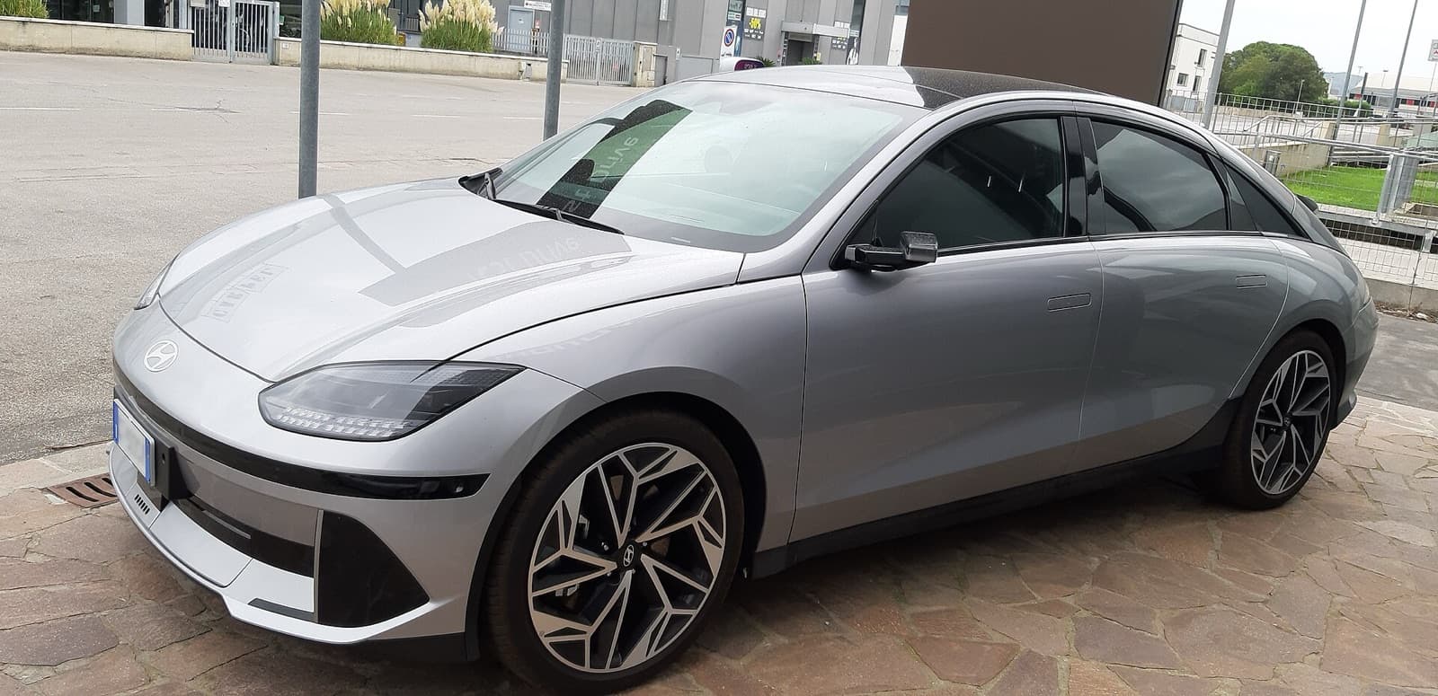 A silver Hyundai Ioniq 6 streamlined electric sedan parked outdoors