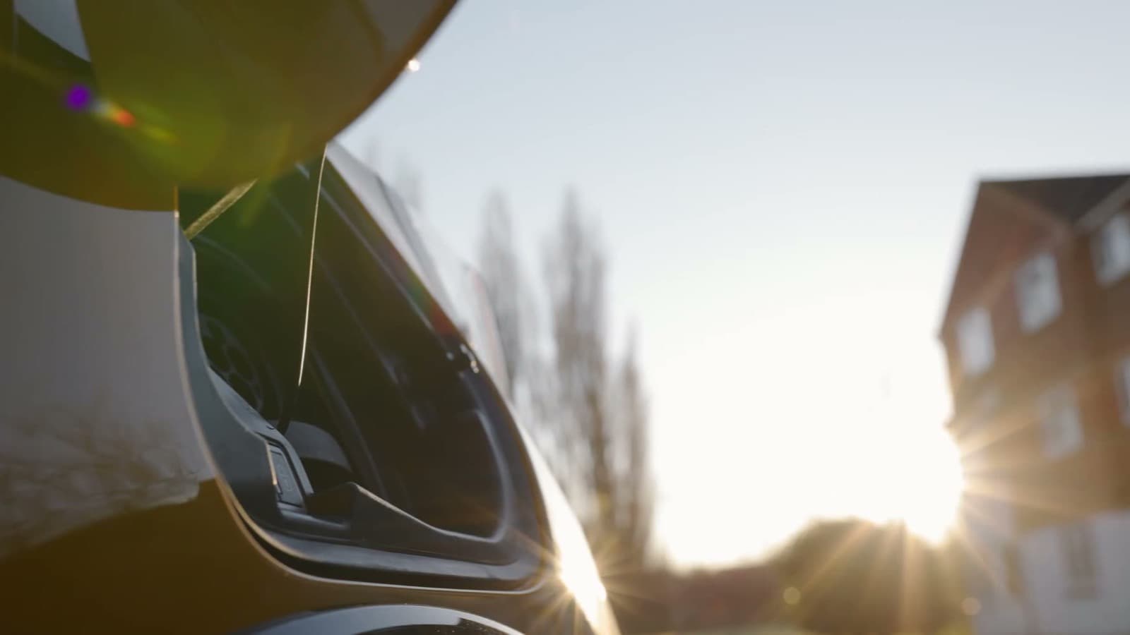 The open charging flap and port on a used electric car